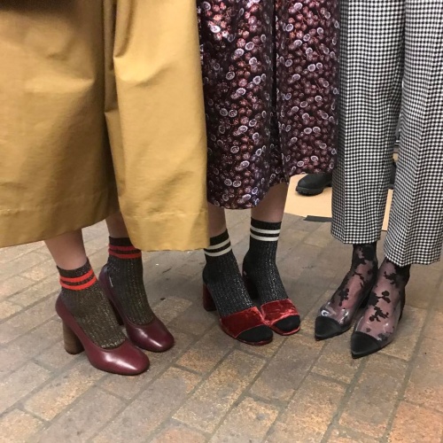 Creatures of Comfort models demonstrating one of the hottest looks of the season- bold socks (photo c/o @creaturesofcomfort)